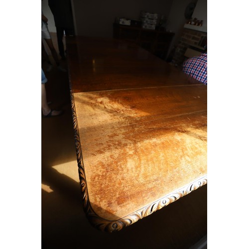 69 - Late Victorian \ early Edwardian heavily carved mahogany extending dining table with 3 extra leaves ... 