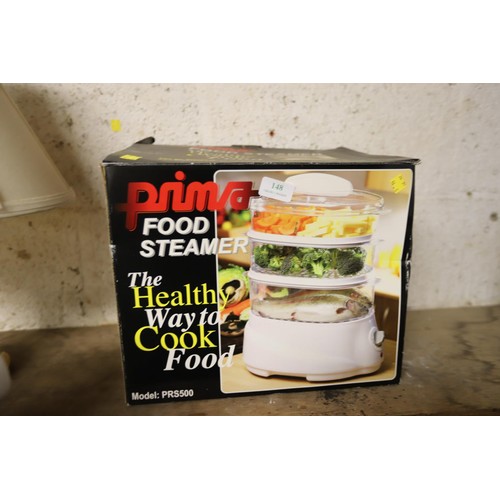 148 - Prima food steamer- boxed - warranted until 12 noon Tuesday following the above sale