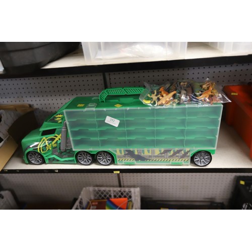 252 - Dinosaur transport truck with 40 small dinosaurs