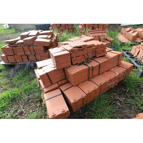 171 - A massive selection of terracotta roof tiles and corner tiles