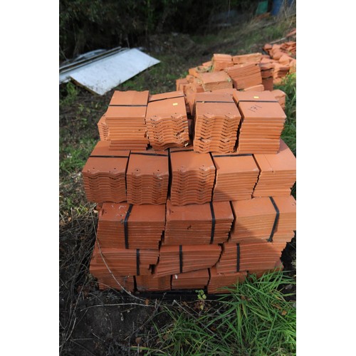 171 - A massive selection of terracotta roof tiles and corner tiles