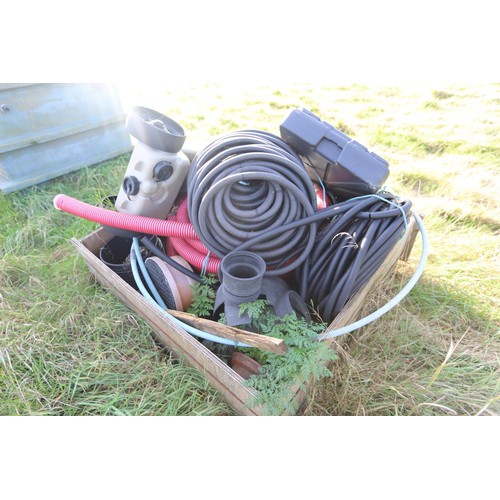 238 - Wooden crate of various wire conduit, water containers etc