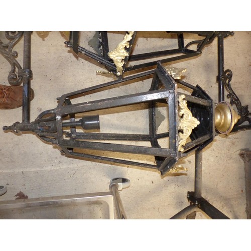 578 - Pair of wrought iron gate lanterns – as found – to be installed rewired and tested by electrician