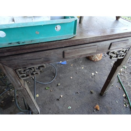 715 - Reproduction Indonesian mahogany desk with several drawer compartments