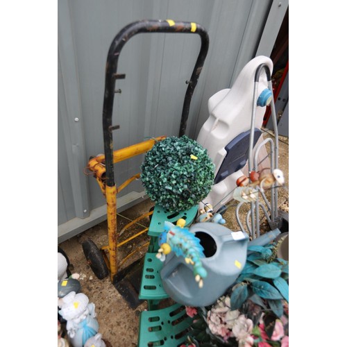 8 - Folding sack barrow, watering can, stand & artificial flowers