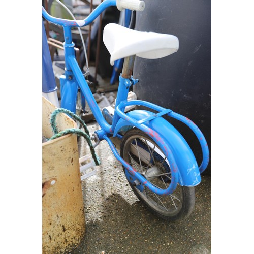 77 - Childs blue bicycle