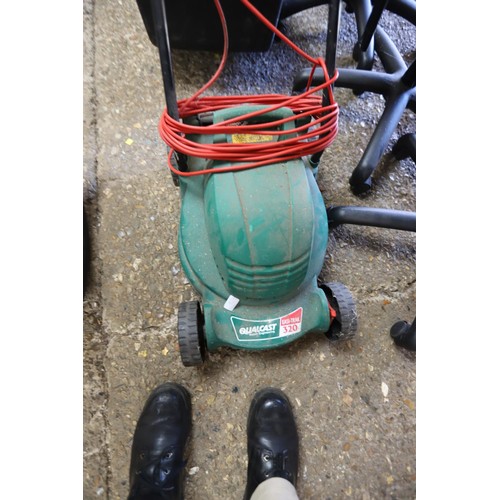 86 - Qualcast electric lawnmower - warranted until 12 noon Tuesday following the above sale