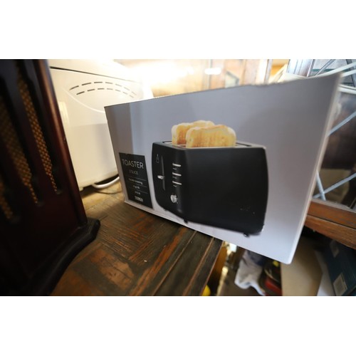 315 - Tesco 2 slice toaster (brand new) - warranted until 12 noon Tuesday following the above sale