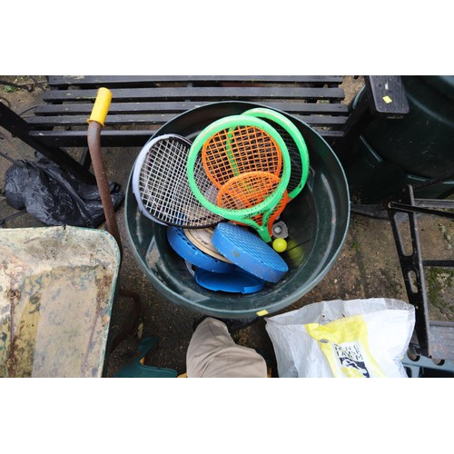 67 - Dust bin containing various rackets, bulbs, water guns & games