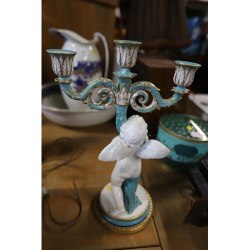 409 - Cherub candelabra, a/f