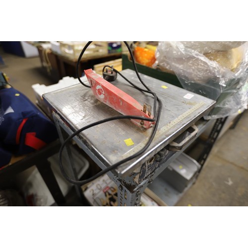 74 - Tile cutter - warranted until noon Tuesday following the above sale