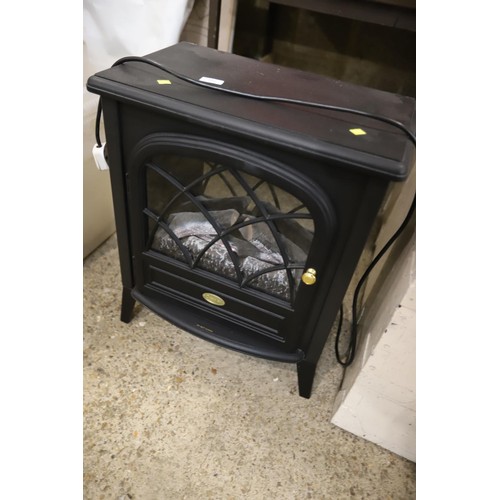 102 - Black electric fire - warranted until 12 noon Tuesday following the above sale