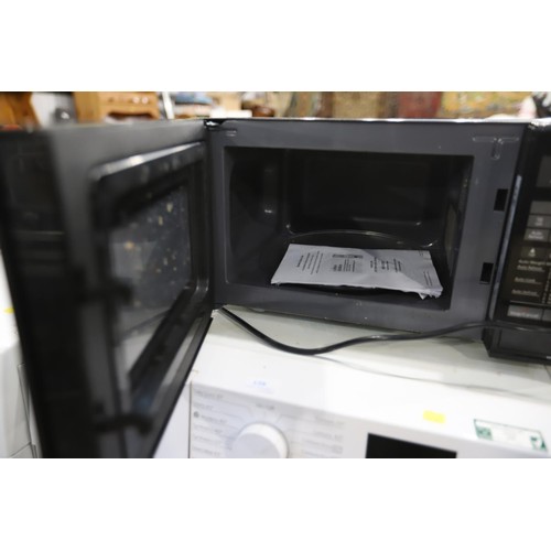 159 - Panasonic microwave - warranted until 12 noon Tuesday following the above sale