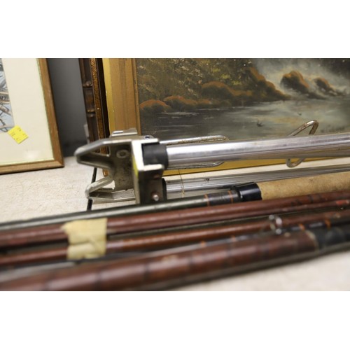 103 - Bundle of fishing rods & rod rest