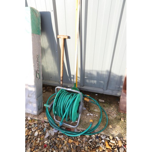 3 - Hose on reel, spade, rake, brush