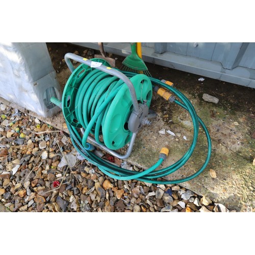 3 - Hose on reel, spade, rake, brush