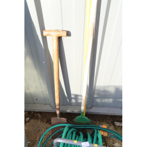 3 - Hose on reel, spade, rake, brush