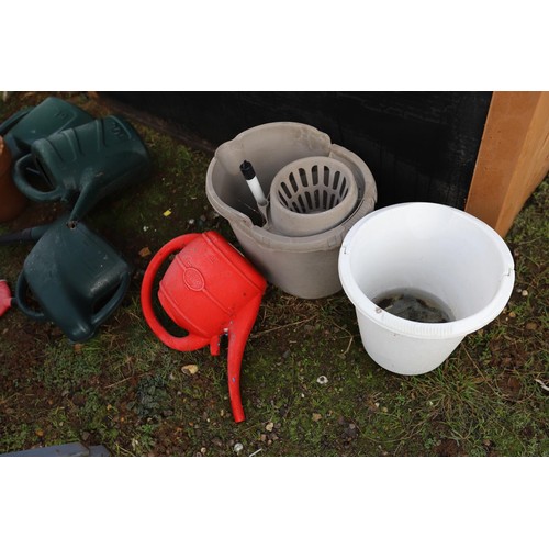 31 - Plastic garden store, incl watering cans, etc