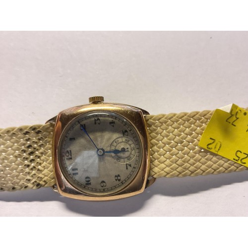 390 - Hallmarked 9ct gold case watch with fabric strap