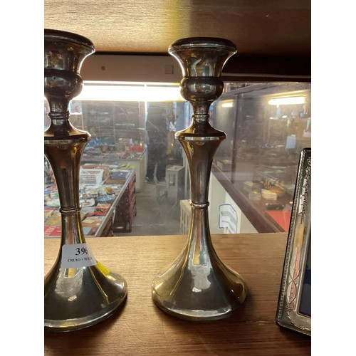 396 - Pair of silver hallmarked candle sticks a/f