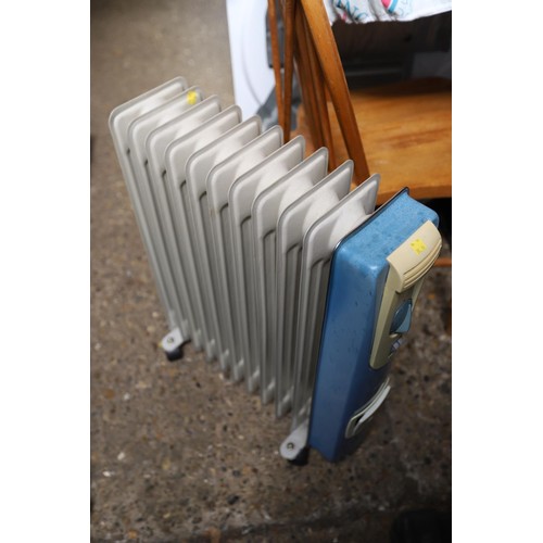 127 - Electric radiator heater - warranted until 12 noon Tuesday following the above sale