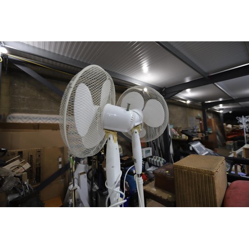 141 - 2 floor standing fans - warranted until 12 noon Tuesday following the above sale