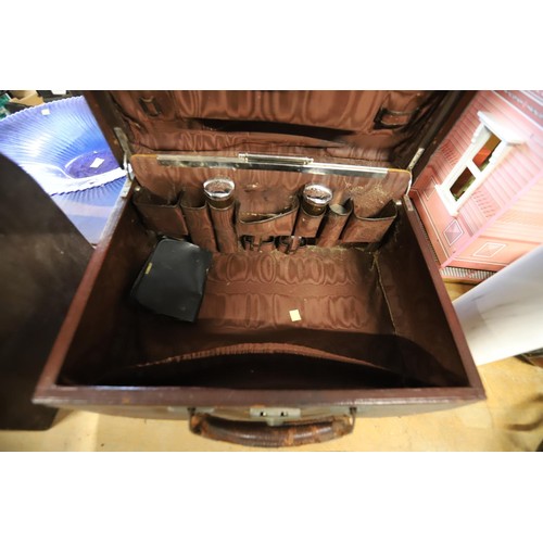 310 - Antique travelling leather vanity case with some accessories