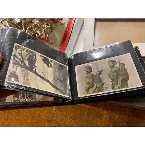 420 - Rare early photographic postcards of native African people & 1940's USA album of postcards