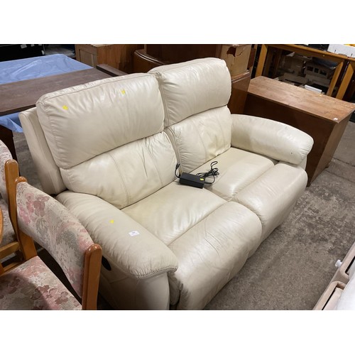 589 - Cream leather 2-seater electric reclining sofa -warranted until 12 noon Tuesday following the above ... 