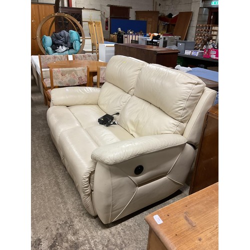 589 - Cream leather 2-seater electric reclining sofa -warranted until 12 noon Tuesday following the above ... 