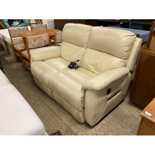 589 - Cream leather 2-seater electric reclining sofa -warranted until 12 noon Tuesday following the above ... 