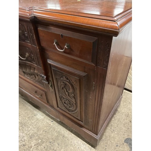 595 - Antique wooden serpentine front carved sideboard