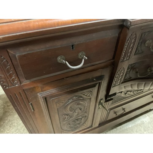 595 - Antique wooden serpentine front carved sideboard