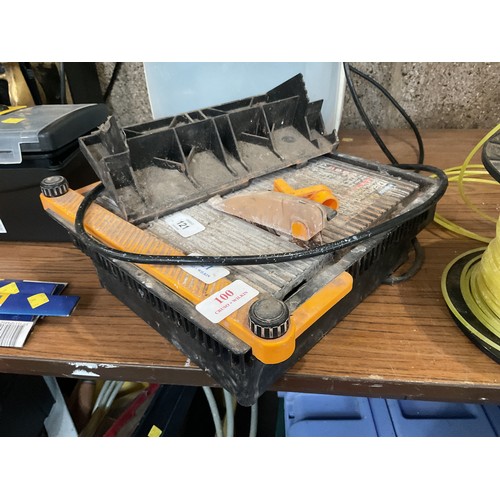 100 - Tile cutter - warranted until noon Tuesday following the above sale