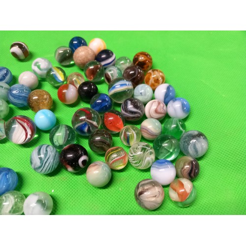 413 - Large qty of antique marbles, incl London bus tin