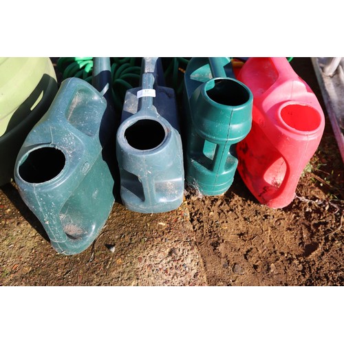 32 - 4 watering cans & hose pipe