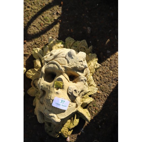 37 - 2 x small skull garden ornaments