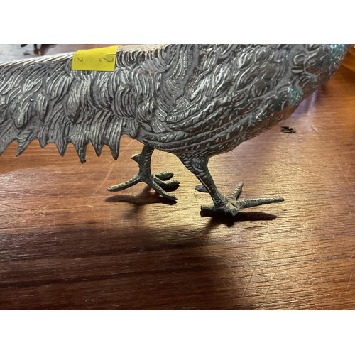 411 - Pair of silver plated peacock & pea hen figurines