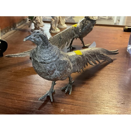 411 - Pair of silver plated peacock & pea hen figurines