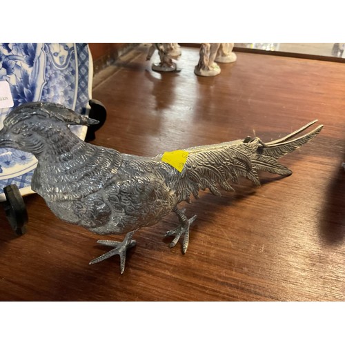 411 - Pair of silver plated peacock & pea hen figurines