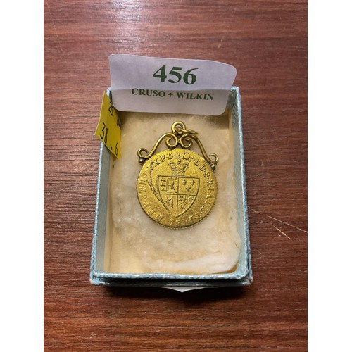 456 - 22ct half guinea mounted in gold