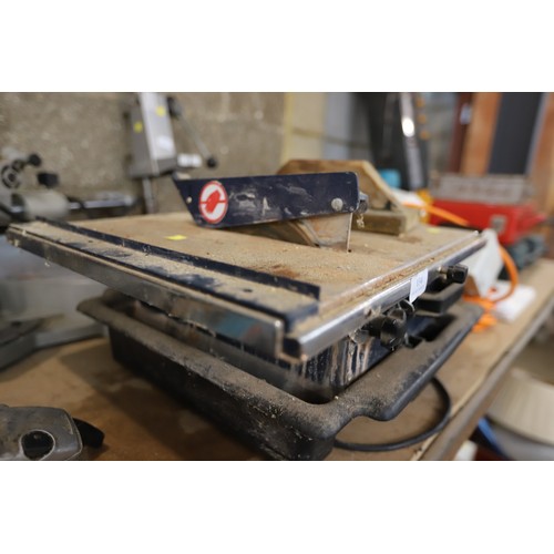 134 - Tile cutter - warranted until 12 noon Tuesday following the above sale