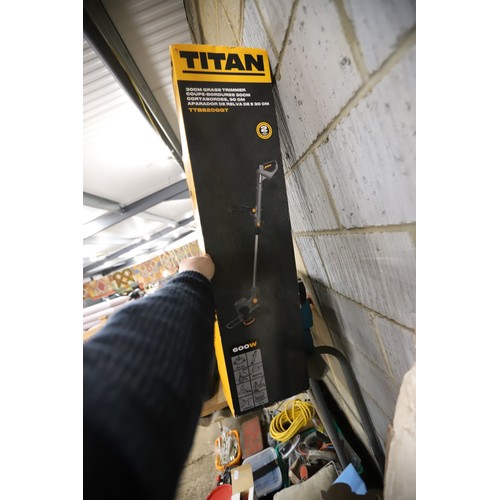 142 - New opened Titan strimmer - warranted until 12 noon Tuesday following the above sale