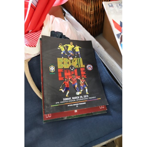 312 - Qty of Arsenal memorabilia, incl clothing, hats, scarves & bags, members books & DVDs, flags, cushio... 