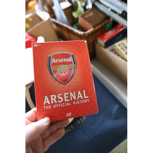 312 - Qty of Arsenal memorabilia, incl clothing, hats, scarves & bags, members books & DVDs, flags, cushio... 