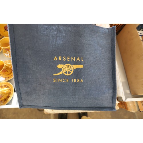 312 - Qty of Arsenal memorabilia, incl clothing, hats, scarves & bags, members books & DVDs, flags, cushio... 