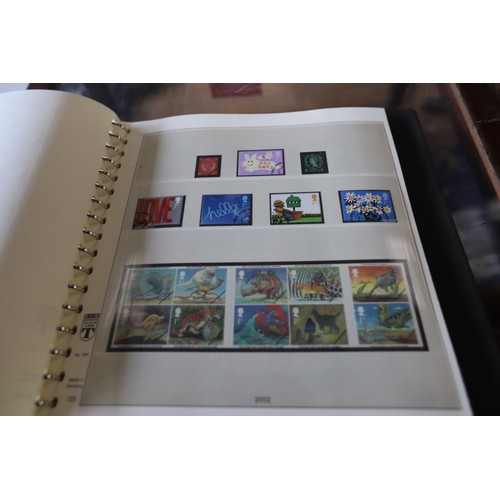 377 - UK stamp album, 2000-2004