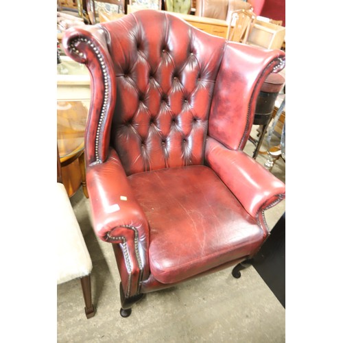 626 - Oxblood Red leather Button back wing armchair with footstool & cushion