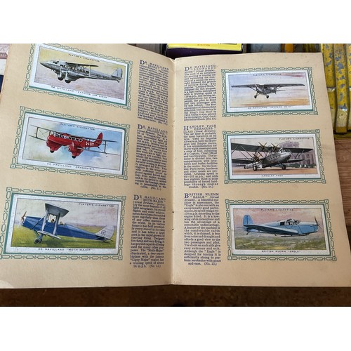 439 - Stamp album, collectors miniature shoes & cigarette cards