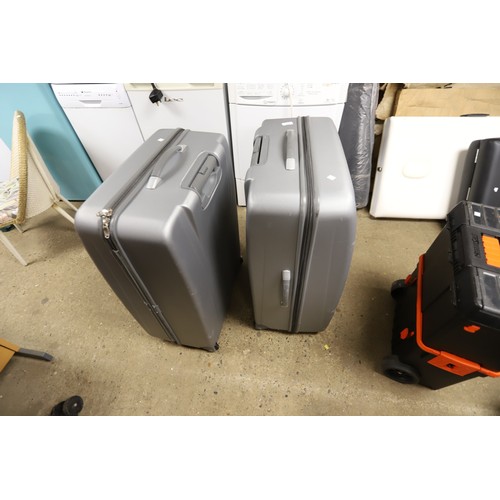 55 - 2 large grey suitcases